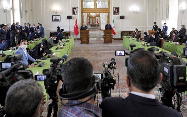 Iran's Foreign Minister Hossein Amir-Abdollahian (C-R) along with his Turkish counterpart Mevlut Cavusoglu (C-L) give a joint press conference in the capital Tehran on November 15, 2021. (AFP)