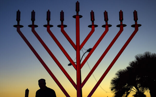 A pre-Hanukkah celebration, hosted by Chabad of Los Alamitos, included the lighting of a 9-foot-tall gold menorah in Seal Beach, on Sunday, November 25, 2018. (Mindy Schauer/Digital First Media/Orange County Register via Getty Images via JTA)