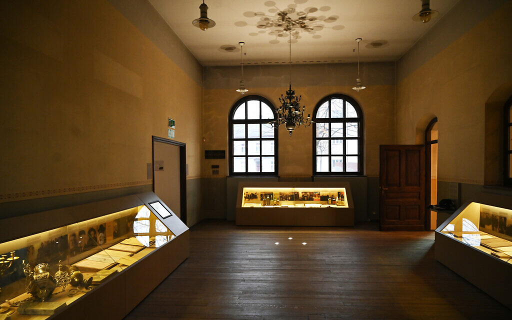 The permanent exhibition at the Auschwitz Jewish Center in Oswiecim, Poland features expensive chandeliers that local Jews might have hid under the floorboards. (Cnaan Liphshiz/ JTA)