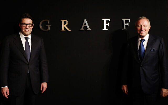 In this Monday, May 21, 2012 file photo, Graff Diamonds Founder and Chairman Laurence Graff, right, and CEO Francois Graff stands before attending an IPO roadshow in Hong Kong. (AP Photo/Vincent Yu, File)
