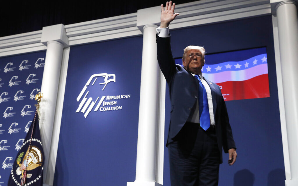 Then-US President Donald Trump waves as he leaves the stage after speaking at the Republican Jewish Coalition's annual leadership meeting, Saturday April 6, 2019, in Las Vegas. (AP Photo/Jacquelyn Martin)