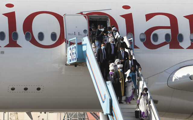 Ethiopian immigrants arrive at Ben Gurion Airport on December 3, 2020. (AP/Sebastian Scheiner)