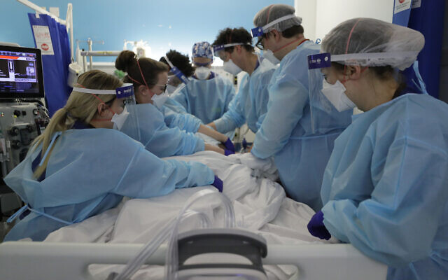 Critical care treat a COVID-19 patient in London  (AP Photo/Kirsty Wigglesworth, Pool)