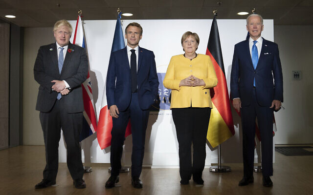 From left: British Prime Minister Boris Johnson, French President Emmanuel Macron, German Chancellor Angela Merkel and U.S. President Joe Biden at the G20 summit in Rome, October 30, 2021. (Stefan Rousseau/Pool via AP)