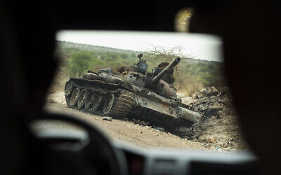 A destroyed tank is seen by the side of the road south of Humera in western Tigray, then annexed by the Amhara region, in Ethiopia, on May 1, 2021. (AP Photo/Ben Curtis, File)