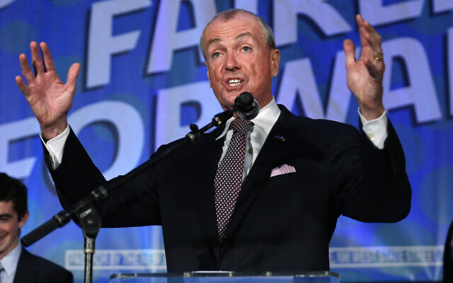 New Jersey Governor Phil Murphy delivers a victory speech after defeating Republican Jack Ciattarelli to win re-election, on November 3, 2021, in Asbury Park, New Jersey. (AP Photo/Noah K. Murray)
