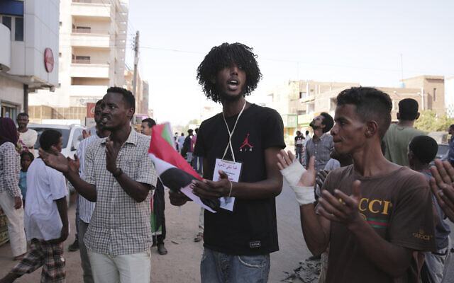 People chant slogans during a protest in Khartoum, amid ongoing demonstrations against a military takeover in Khartoum, Sudan, November 4, 2021. (AP Photo/Marwan Ali)