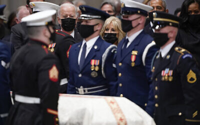 President Joe Biden and first lady Jill Biden watch the casket during a funeral for former Secretary of State Colin Powell at the Washington National Cathedral, in Washington, Friday, Nov. 5, 2021. At right are former President Barack Obama and former first lady Michelle Obama. (AP Photo/Andrew Harnik)