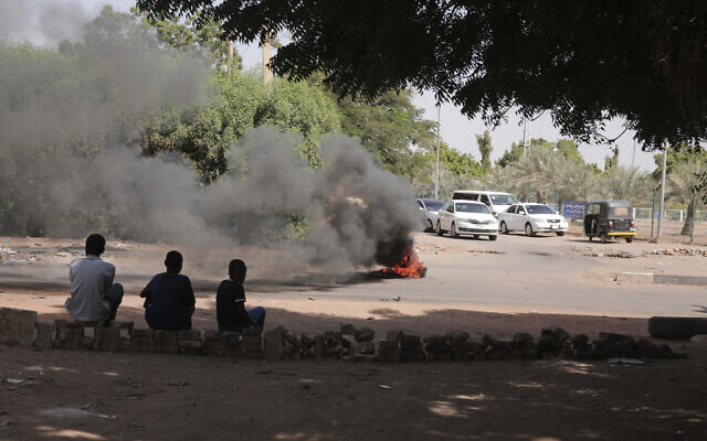 People burn tires in Khartoum, Sudan, November 7, 2021. (AP Photo/Marwan Ali)
