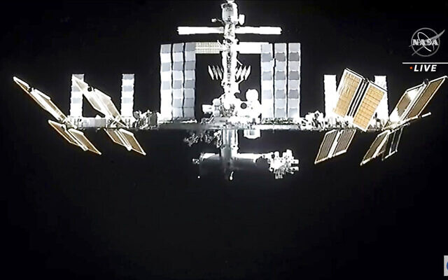 In this image from video provided by NASA, the International Space Station is seen as astronauts in the SpaceX Dragon capsule undock on November 8, 2021. (NASA via AP)