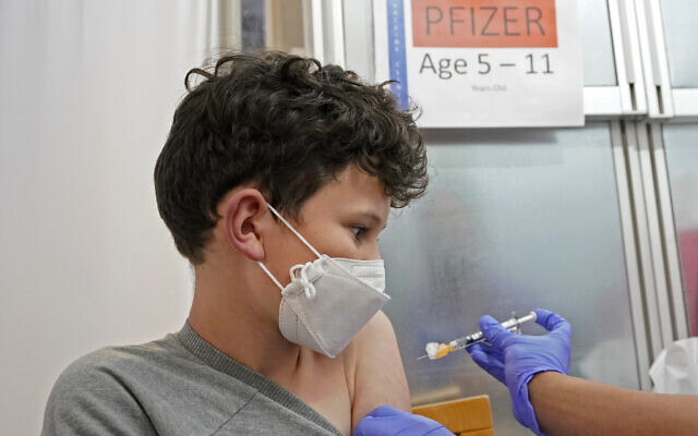 An 11-year-old gets the first shot of the Pfizer COVID-19 vaccine, November 9, 2021, at the University of Washington Medical Center in Seattle. (AP Photo/Ted S. Warren)