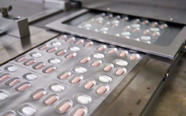 This image provided by Pfizer shows its anti-COVID pills. (Pfizer via AP)