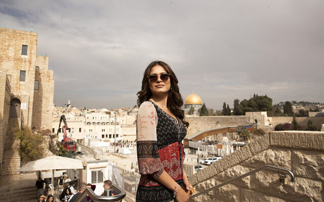 Andrea Meza, the reigning Miss Universe from Mexico, poses overlooking the Western Wall and the Dome of the Rock Mosque as she tours the Old City of Jerusalem, on Wednesday, November 17, 2021, ahead of the 70th Miss Universe pageant being staged in Eilat next month. (AP Photo/Maya Alleruzzo)