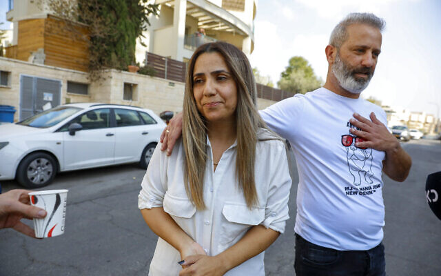 Natali and Mordy Oknin, who were held in Turkey for a week on suspicion of espionage, speak to journalists hours after they were released at their home in Modiin, on November 18, 2021. (AP Photo/Ariel Schalit)