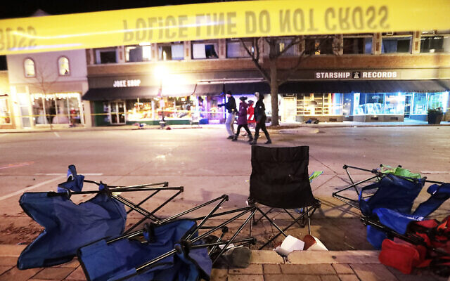 Toppled chairs line W. Main St. in downtown Waukesha, Wis., after an SUV drove into a parade of Christmas marchers on November 21, 2021. (John Hart/Wisconsin State Journal via AP)