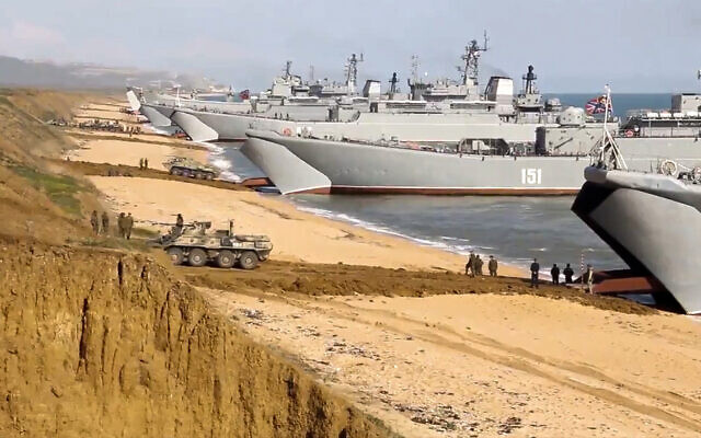 This frame from a video released on April 23, 2021, by Russian Defense Ministry Press Service shows, Russian troops board landing vessels after drills in Crimea. Ukrainian and Western officials are worried that a Russian military buildup near Ukraine could signal plans by Moscow to invade its ex-Soviet neighbor. The Kremlin insists it has no such intention and has accused Ukraine and its Western backers of making the claims to cover up their own allegedly aggressive designs. (Russian Defense Ministry Press Service via AP, File)