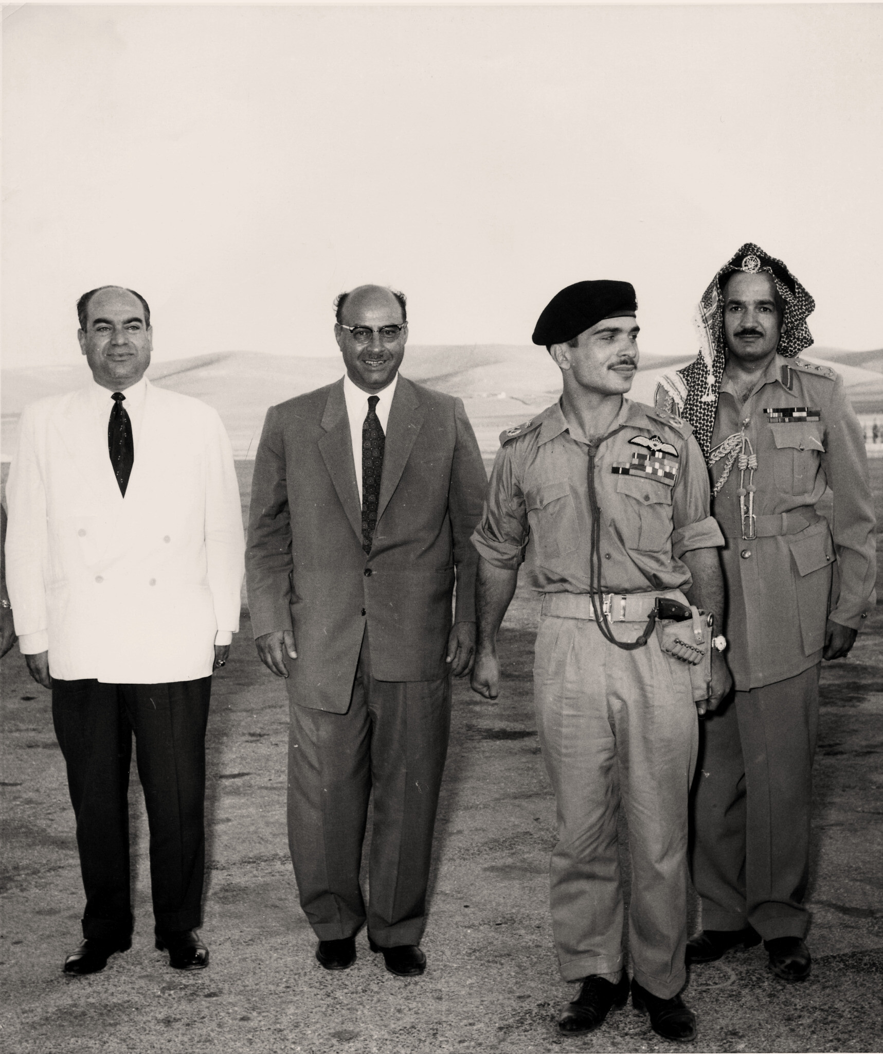 King Hussein of Jordan and his bodyguard (right), together with Dr. Mohsmmed Al-Qutob (second left) and a member of his team, at Jerusalem Airport in the 1960s (Dr. Mohammed Al-Qutob Family Archive / From the exhibition "Gateway to the World: Jerusalem Airport 1948-1967")