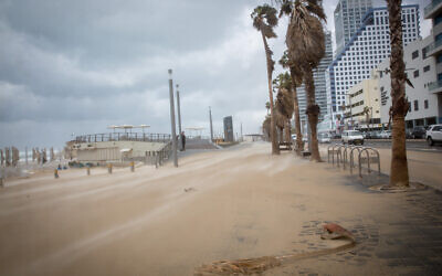 Illustrative: A beach in Tel Aviv during stormy weather, on February 17, 2021. (Miriam Alster/Flash90)