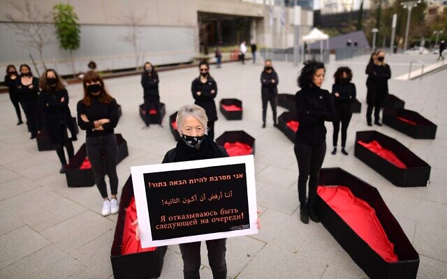 Activists protest against recent cases of violence against women in Tel Aviv, on March 7, 2021. (Tomer Neuberg/Flash90)