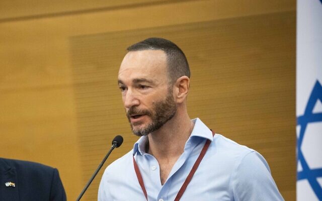LGBT rights activist Etai Pinkas Arad at a press conference at the Knesset, July 11, 2021, after the High Court of Justice ruled that same-sex couples and single men will be able to become surrogate parents within six months. (Yonatan Sindel/Flash90)