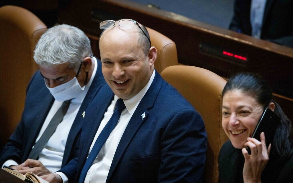 Prime Minister Naftali Bennett (center) at the Knesset during voting on the state budget, on November 4, 2021. (Yonatan Sindel/Flash90)