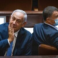 Opposition leader Benjamin Netanyahu (left) with Likud MK Yuli Edelstein in the Knesset on November 4, 2021. (Yonatan Sindel/Flash90)