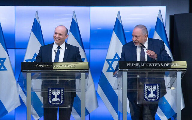 Prime Minister Naftali Bennett, left, and Finance Minister Avigdor Liberman at a press conference in Jerusalem on November 6, 2021. (Ohad Zwigenberg/Pool/Flash90)