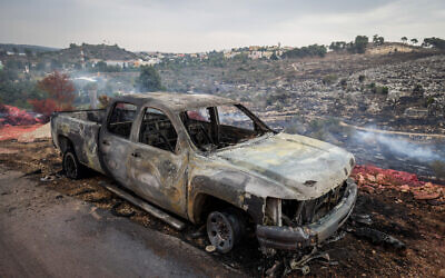 A burnt-out car after a fire in Ma'alot-Tarshiha, northern Israel, on November 14, 2021 (David Cohen/Flash90)