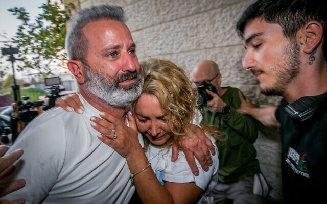 Mordy Oknin (left), who was jailed along with his wife Natali for photographing the Turkish president’s palace, arrives at their home in Modiin, November 18, 2021. (Yossi Aloni/Flash90)