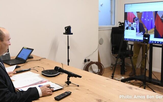 Prime Minister Naftali Bennett holds a video consultation with the leaders of Austria and the Czech Republic on November 30, 2021. (Amos Ben-Gershom/GPO)