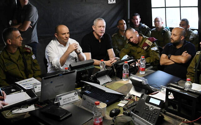 From left to right: IDF Chief of Staff Aviv Kohavi, Prime Minister Naftali Bennett and Defense Minister Benny Gantz attend a military drill in northern Israel on November 16, 2021. (Amos Ben-Gershom/GPO)