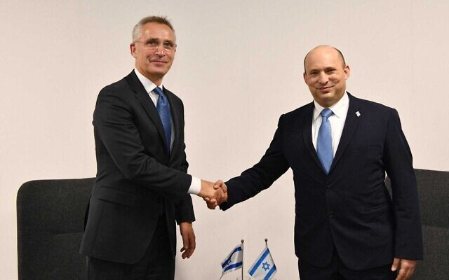 Prime Minister Naftali Bennett (right) meets with NATO Secretary General Jens Stoltenberg at the UN Climate Change Conference in Glasgow, Scotland, November 2, 2021. (Haim Zach/GPO)