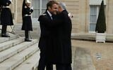 Then-foreign minister Yair Lapid (R) embraces French President Emmanuel Macron in Paris, November 30, 2021 (Quentin Crestinu)