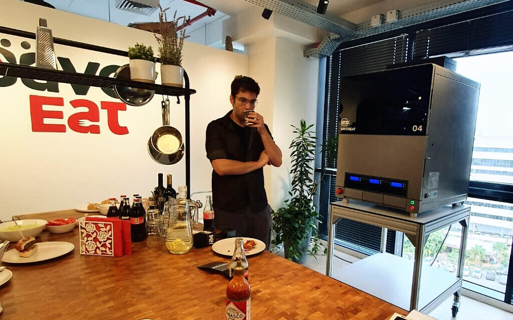 SavorEat's 'robot chef' combines plant-based ingredients and cooks the patties. (Times of Israel staff)