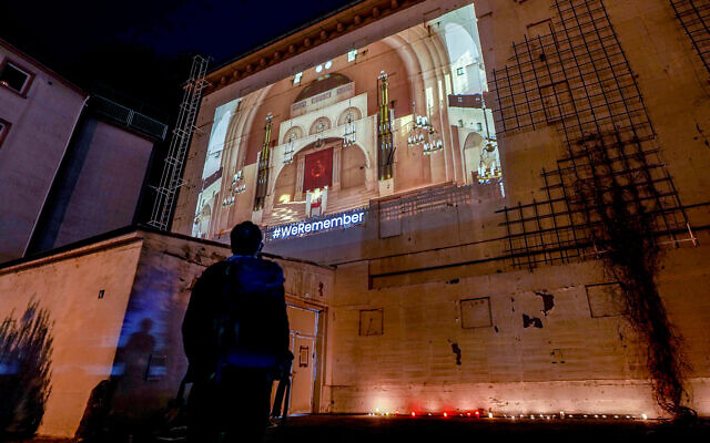 A photo of the synagogue that was on this spot is projected on a bunker in Frankfurt, Germany, Nov. 9, 2021, during a memorial event on the 83th anniversary of the Nazis' anti-Jewish Kristallnacht pogrom in 1938. (AP Photo/Michael Probst)