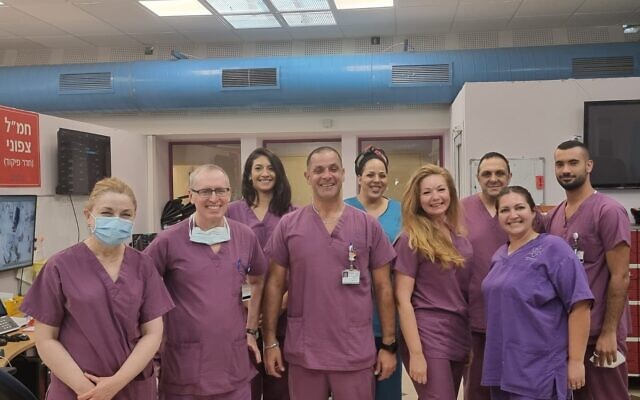 Staff at the Galilee Medical Center pose for a photo as they close their final COVID-19 ward (courtesy of the Galilee Medical Center)