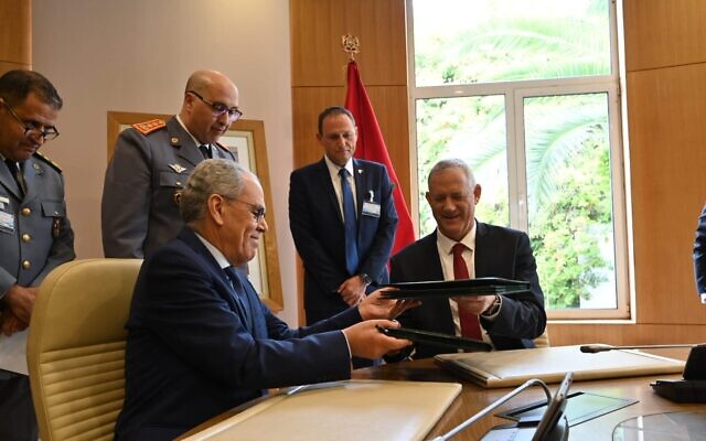 Defense Minister Benny Gantz, right, with his Moroccan counterpart Abdellatif Loudiyi, after signing a memorandum of understanding between the two countries at the Moroccan Defense Ministry in Rabat on November 24, 2021. (Defense Ministry)