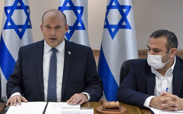 Prime Minister Naftali Bennett (left) opens a meeting of the coronavirus cabinet, on November 17, 2021. (Kobi Gideon/GPO)