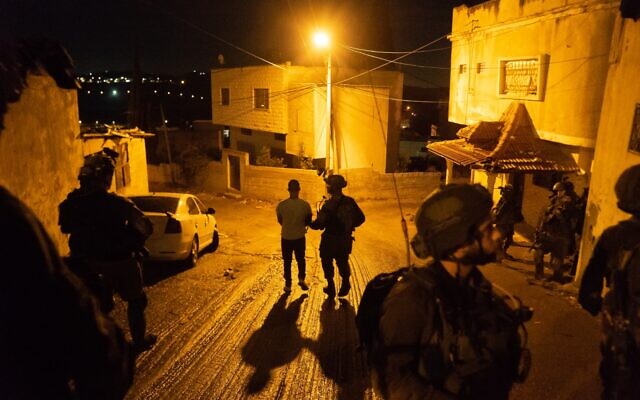 An undated photograph showing Israeli forces arresting a suspect believed to be involved in a major Hamas cell planning terror attacks on Israeli targets in the West Bank and Jerusalem. (Israel Defense Forces)