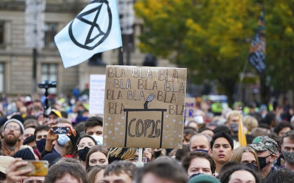Climate activists march through the streets of Glasgow, Scotland, on November 5, 2021. (AP Photo/Jon Super)