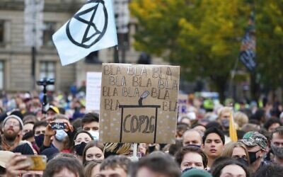 Climate activists march through the streets of Glasgow, Scotland, on November 5, 2021. (AP Photo/Jon Super)