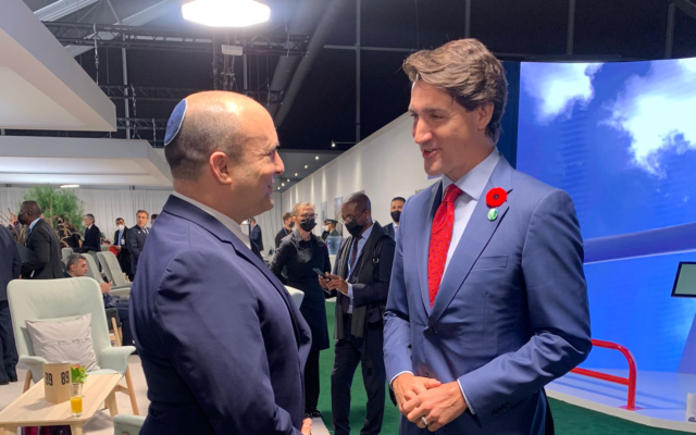 Prime Minister Naftali Bennett (left) meets Canadian Prime Minister Justin Trudeau at the COP26 UN climate summit in Glasgow, Scotland, November 1, 2021. (Courtesy)