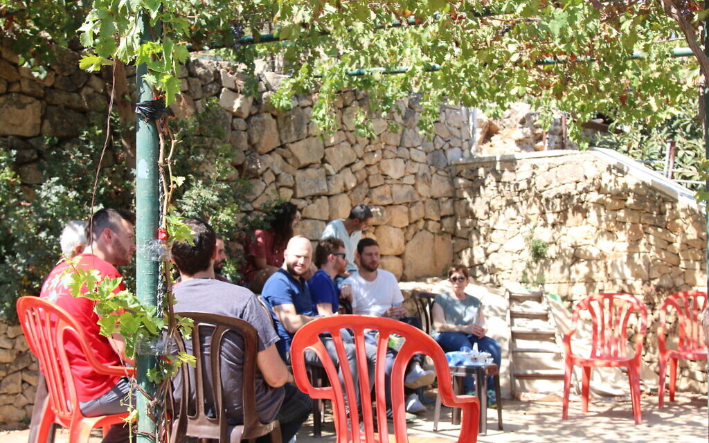Blend.ar participants relax in Bana Abu Katish's family garden, October 2021. (Shmuel Bar-Am)