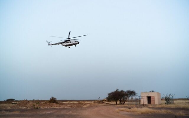 An MI-8 helicopter of the United Nations Multidimensional Integrated Stabilization Mission in Mali (MINUSMA), lands at the UN base in Menaka, Mali, on October 22, 2021. (Florent Vergnes/AFP)