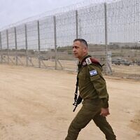 Lieutenant General Aviv Kohavi, Israel's army chief of general staff, pictured by the newly completed barrier above and below the border with the Gaza Strip, near Moshav Netiv HaAsara in southern Israel on December 7, 2021 (MENAHEM KAHANA / AFP)