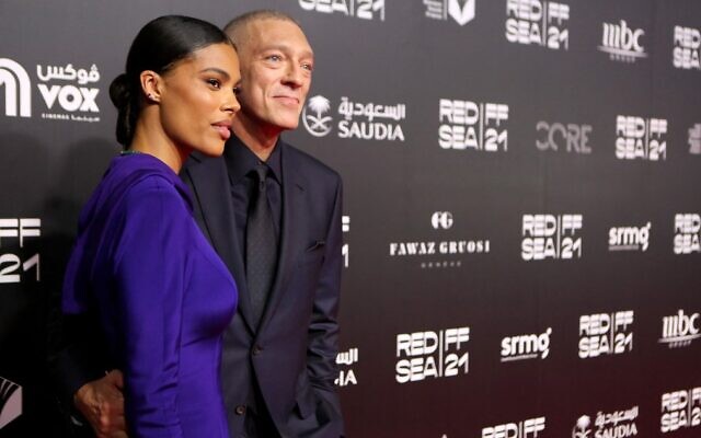 French actor Vincent Cassel and model Tina Kunakey pose on the red carpet of the first edition of the Red Sea Film Festival in the Saudi city of Jeddah, on December 6, 2021. (PATRICK BAZ / Red Sea Film Festival)