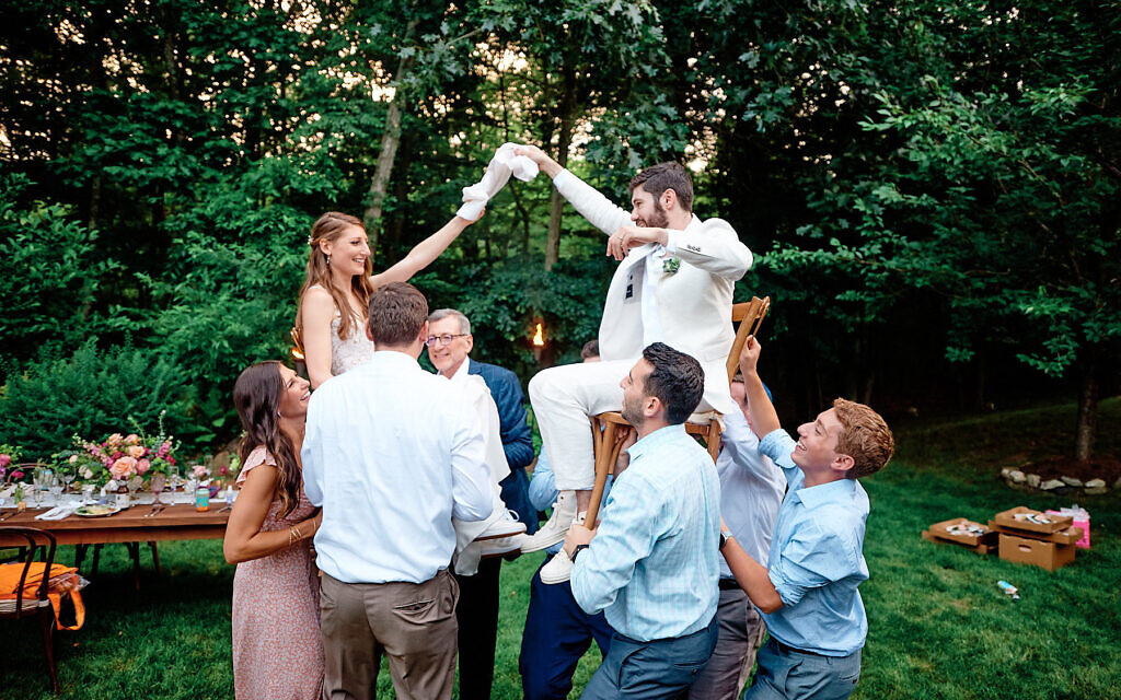 Eric Fischer and Danielle Clemons held their wedding on July 2, 2020 in her family's backyard in Armonk, New York with just 14 people. (Eric Fischer and Danielle Clemons/via JTA)