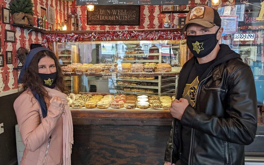 Yuri Foreman (right) and his wife Shoshana Foreman run VBR Kosher, which certifies the vegan Dun-Well Donuts in Brooklyn. (Ben Sales/JTA)