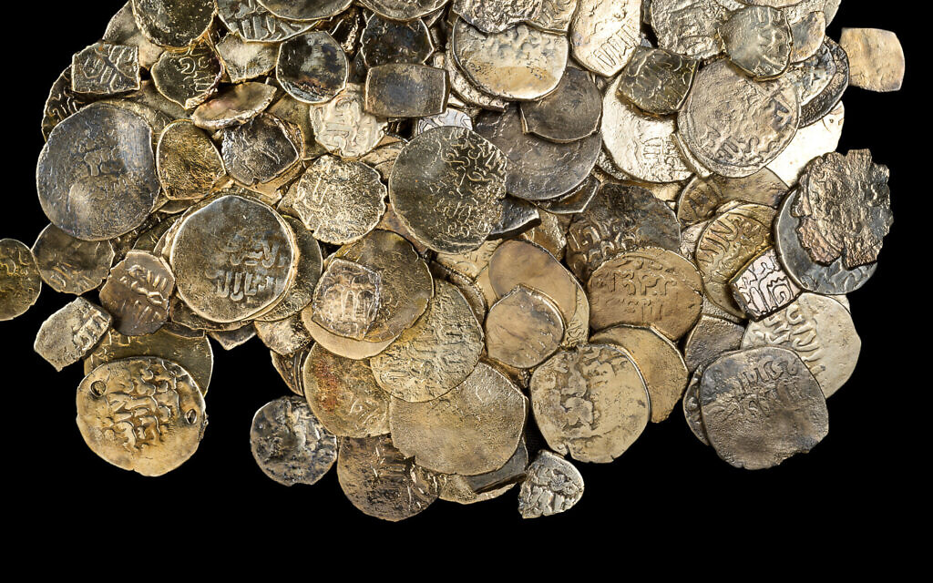 A hoard of coins from the Mamluk period recently discovered in a shipwreck off the coast of Caesarea. (Dafna Gazit/Israel Antiquities Authority)