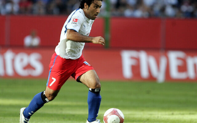 Mehdi Mahdavikia from Iran plays a match in Hamburg, northern Germany, Saturday, Aug 5, 2006. (AP Photo/Kai-Uwe Knoth)
